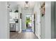 Inviting home entrance with wood-look floors and a charming entryway; the kitchen is partially visible at 5801 Oyster Catcher Dr. # 1214, North Myrtle Beach, SC 29582