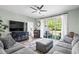Comfortable living room with a large sectional sofa, ceiling fan, and sliding glass doors to the outdoor space at 5801 Oyster Catcher Dr. # 1214, North Myrtle Beach, SC 29582