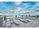 Rooftop deck with lounge chairs overlooking the ocean at 5801 Oyster Catcher Dr. # 1214, North Myrtle Beach, SC 29582