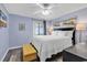 This bedroom features a ceiling fan, a flatscreen TV, and coastal-themed decorations at 6000 N North Ocean Blvd. # 329, North Myrtle Beach, SC 29582