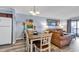 Cozy dining area with a table, chairs, and living room view at 6000 N North Ocean Blvd. # 329, North Myrtle Beach, SC 29582