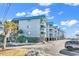 Exterior of a Sea Cabin Cherry Grove building with private balconies and parking at 6000 N North Ocean Blvd. # 329, North Myrtle Beach, SC 29582