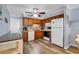 Efficient kitchen featuring wood cabinets, white appliances, and modern flooring at 6000 N North Ocean Blvd. # 329, North Myrtle Beach, SC 29582