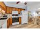 Efficient kitchen features wood cabinets, a full-sized refrigerator, and an electric range at 6000 N North Ocean Blvd. # 329, North Myrtle Beach, SC 29582