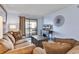 Comfortable living room with balcony access and a flatscreen TV at 6000 N North Ocean Blvd. # 329, North Myrtle Beach, SC 29582