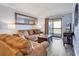 Cozy living room with comfortable seating, large mirror, and sliding door to the balcony at 6000 N North Ocean Blvd. # 329, North Myrtle Beach, SC 29582