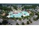 Aerial view of the community pool area with multiple pools, clubhouse, and ample parking at 7110 Shooting Star Way, Myrtle Beach, SC 29579