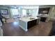 Open-concept kitchen featuring a center island with granite countertop and stainless steel appliances at 7110 Shooting Star Way, Myrtle Beach, SC 29579