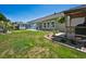 Landscaped backyard featuring a patio, pergola, and well-manicured lawn, perfect for outdoor enjoyment at 757 Cherry Blossom Dr., Murrells Inlet, SC 29576