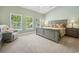 Bright bedroom with large windows, neutral walls, and a comfortable queen-sized bed at 757 Cherry Blossom Dr., Murrells Inlet, SC 29576