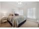 Bright bedroom with ample natural light, a quilt-covered bed and nautical-themed decor at 757 Cherry Blossom Dr., Murrells Inlet, SC 29576