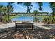 Enjoy lake views from a community gathering spot complete with a fire pit and bench at 757 Cherry Blossom Dr., Murrells Inlet, SC 29576
