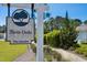Elegant community entrance sign surrounded by manicured gardens and scenic walking paths at 757 Cherry Blossom Dr., Murrells Inlet, SC 29576