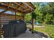 Outdoor grill area with a covered structure, perfect for BBQ's and entertaining in the backyard at 757 Cherry Blossom Dr., Murrells Inlet, SC 29576