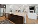 Spacious kitchen island features granite countertops, dark wood cabinets, and stainless steel appliances at 757 Cherry Blossom Dr., Murrells Inlet, SC 29576