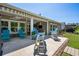 Outdoor patio featuring stylish furniture and a manicured lawn, perfect for outdoor living at 757 Cherry Blossom Dr., Murrells Inlet, SC 29576