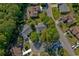 An aerial view shows a property surrounded by lush trees in a quiet neighborhood setting at 802 Mockingbird Ct., Murrells Inlet, SC 29576