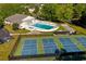 Aerial view shows the pool, shuffleboard, and pickleball/tennis courts, offering recreational activities at 802 Mockingbird Ct., Murrells Inlet, SC 29576