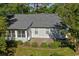 Back of house has a brick patio and some shade trees at 802 Mockingbird Ct., Murrells Inlet, SC 29576