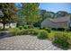 Landscaped backyard with a stone patio and well-manicured lawn at 802 Mockingbird Ct., Murrells Inlet, SC 29576