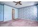 Bedroom features classic floral wallpaper, ceiling fan, and carpet at 802 Mockingbird Ct., Murrells Inlet, SC 29576