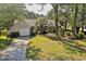 Charming single-story home with a manicured lawn, mature trees, and an attached garage at 802 Mockingbird Ct., Murrells Inlet, SC 29576