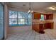 Bright eat-in kitchen area featuring natural light, ample cabinet space, and tiled flooring at 802 Mockingbird Ct., Murrells Inlet, SC 29576