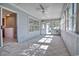 Bright sunroom featuring a ceiling fan and multiple large windows at 802 Mockingbird Ct., Murrells Inlet, SC 29576