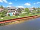 Backyard with direct lake access, a private dock, fire pit, and mature landscaping at 8029 Wacobee Dr., Myrtle Beach, SC 29579
