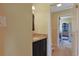 This bathroom features a granite vanity with dark cabinets at 8029 Wacobee Dr., Myrtle Beach, SC 29579