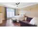 Inviting bedroom with a large arched window and a cozy sitting area at 8029 Wacobee Dr., Myrtle Beach, SC 29579