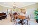 Elegant dining room featuring a dark wood table, tile flooring, and stylish decor at 8029 Wacobee Dr., Myrtle Beach, SC 29579