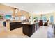 Open kitchen with granite countertops, custom cabinetry, and a view of the dining area at 8029 Wacobee Dr., Myrtle Beach, SC 29579