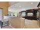 Modern kitchen with dark cabinetry, granite countertops, and bar seating at 8029 Wacobee Dr., Myrtle Beach, SC 29579