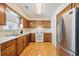 Kitchen featuring wood cabinets, stainless steel refrigerator, and electric range at 844 Wachesaw Rd., Murrells Inlet, SC 29576
