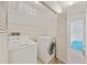 Laundry room featuring a washer, dryer, and wire shelving at 844 Wachesaw Rd., Murrells Inlet, SC 29576