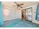 Open living area with sliding doors leading to another room, natural light, and shelving at 844 Wachesaw Rd., Murrells Inlet, SC 29576