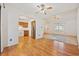 Spacious living room with hardwood floors that seamlessly connects to the kitchen and dining area at 844 Wachesaw Rd., Murrells Inlet, SC 29576