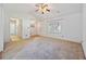 Bright living room featuring neutral carpet, ceiling fan, and vaulted ceilings at 844 Wachesaw Rd., Murrells Inlet, SC 29576