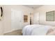 Bright bedroom with neutral walls, closet, ensuite and decorative art at 861 Farmers Passage Loop, Loris, SC 29569