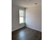 Cozy bedroom featuring dark hardwood floors and natural light at 905 Inlet Keys St., Murrells Inlet, SC 29576