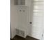 Mud room with custom bench and coat rack next to the door at 905 Inlet Keys St., Murrells Inlet, SC 29576