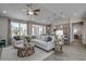 Open-concept living area with ample natural light, modern furnishings, and seamless kitchen access at 905 Inlet Keys St., Murrells Inlet, SC 29576