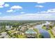 Aerial view of a coastal community featuring waterfront properties, lush landscaping, and community pool at 9060 Abingdon Dr., Myrtle Beach, SC 29579