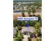 Beautiful aerial view of 9060 Abingdon Dr, surrounded by lush greenery, mature trees, and a tranquil community lake at 9060 Abingdon Dr., Myrtle Beach, SC 29579