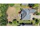 Overhead view of property with open backyard, patio seating, and mature shade trees at 9060 Abingdon Dr., Myrtle Beach, SC 29579