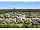 Aerial view of 9060 Abingdon Dr, nestled within a beautiful community, with Myrtle Beach visible in the distance at 9060 Abingdon Dr., Myrtle Beach, SC 29579