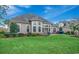 Well-maintained backyard, featuring a lush lawn and an inviting exterior of the home at 9060 Abingdon Dr., Myrtle Beach, SC 29579