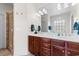Bathroom with a double sink vanity, tile floor, shower and large mirror at 9060 Abingdon Dr., Myrtle Beach, SC 29579