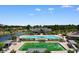 Overhead view of a community pool and clubhouse overlooking lush landscaping and nearby residences at 9060 Abingdon Dr., Myrtle Beach, SC 29579